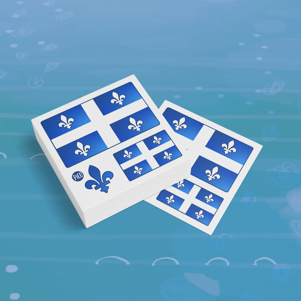 Tatouage temporaire La fête du Québec avec fleur de lys bleue et drapeau du Québec sur fond blanc, format 2 pouces par 2 pouces pour enfants / La Fête du Québec temporary tattoo with blue fleur-de-lys and Quebec flag on white background, 2 inches by 2 inches format for kids.
