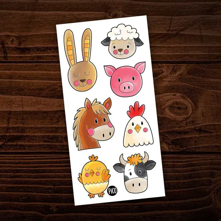 Tatouages temporaires pour enfants illustrant des animaux de la ferme, dont un lapin, un mouton, un cochon, un cheval, une poule et une vache, aux couleurs vives sur fond blanc.

Temporary tattoos for children featuring farm animals, including a rabbit, sheep, pig, horse, hen and cow, in bright colors on a white background.