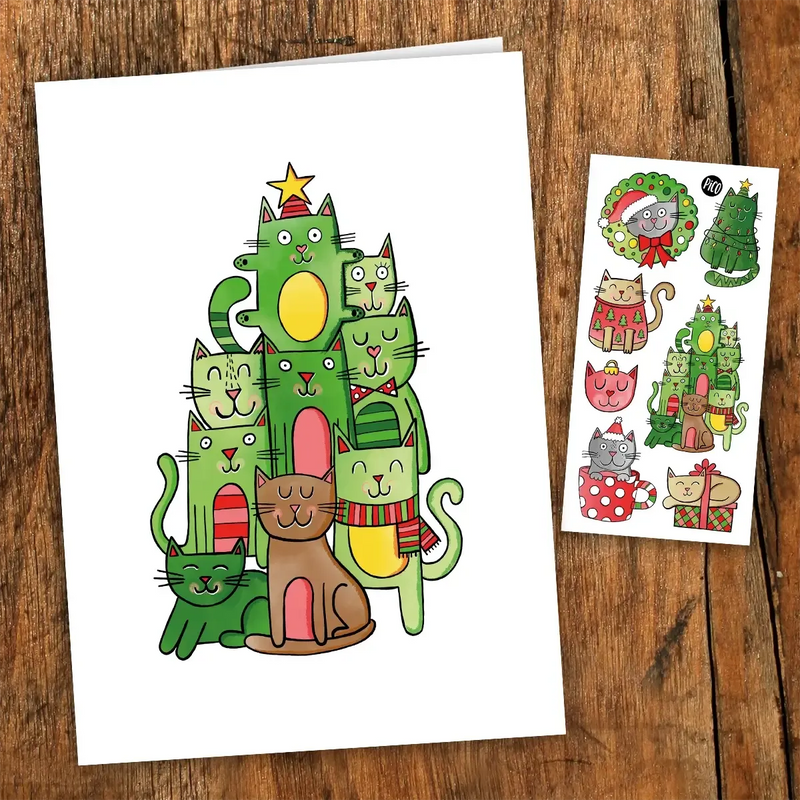 Carte de voeux de chat de Noël par PiCO Temporary Tattoos. Les cartes sont imprimées au Canada. Comprend une feuille de tatouages temporaires. / Christmas cat greeting card by PiCO Temporary Tattoos. Cards are printed in Canada. Includes a sheet of temporary tattoos.