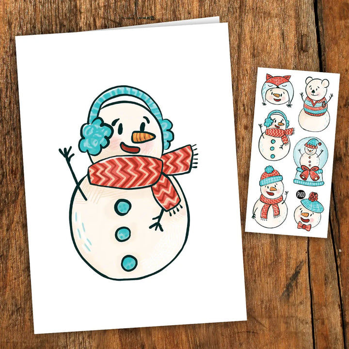 Carte de souhaits PiCO Tatoo pour Noël comprenant des tatouages temporaires de bonhomme de neige